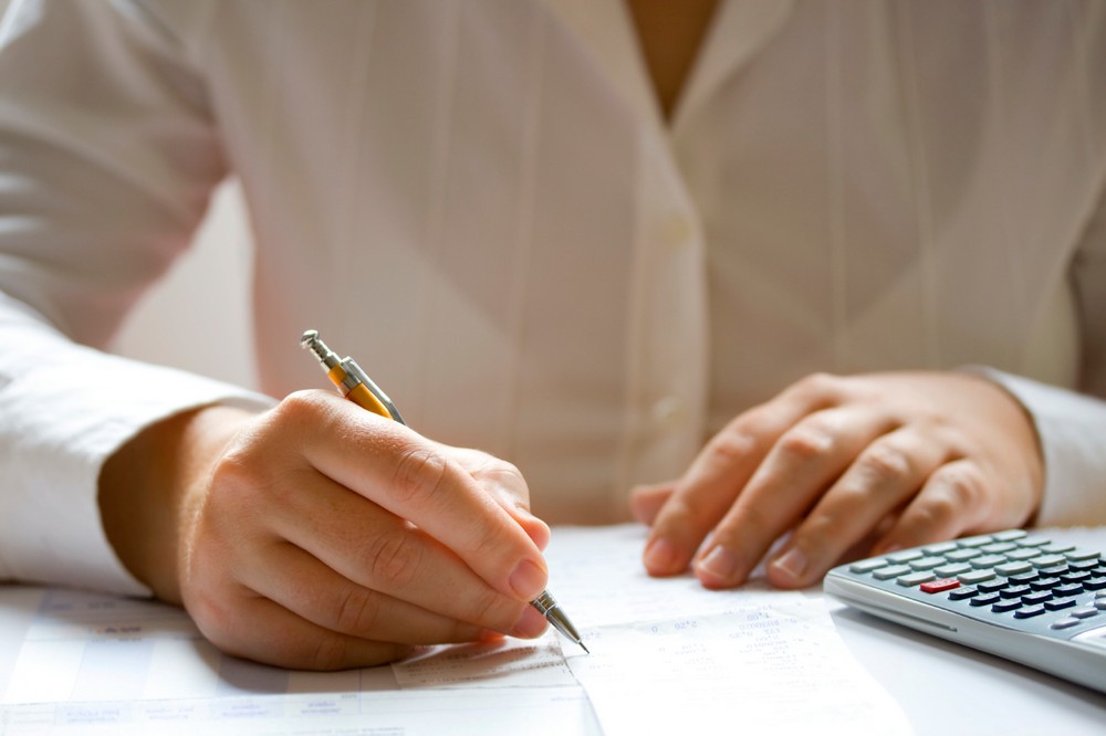 Businesswoman calculating data